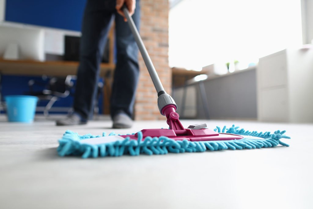 Office cleaning in San Mateo County with a blue mop.