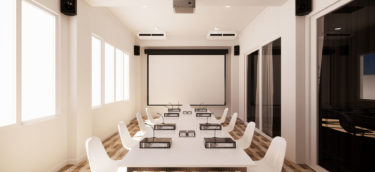 Modern conference room in San Mateo County with a projector, screen, and seating for nine, including commercial cleaning.