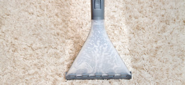 Carpet cleaning using a steam cleaner nozzle in San Mateo County.