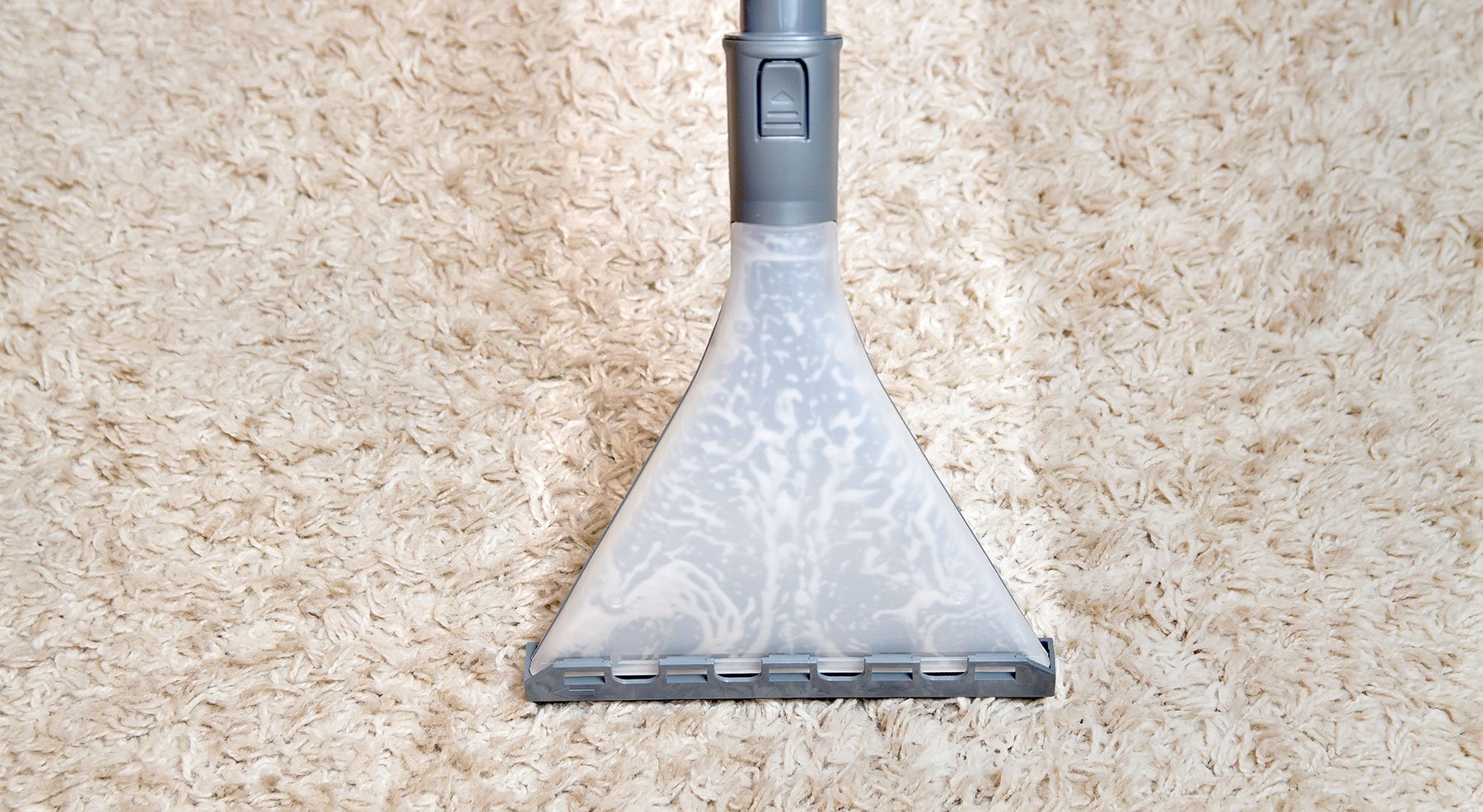 Carpet cleaning using a steam cleaner nozzle in San Mateo County.