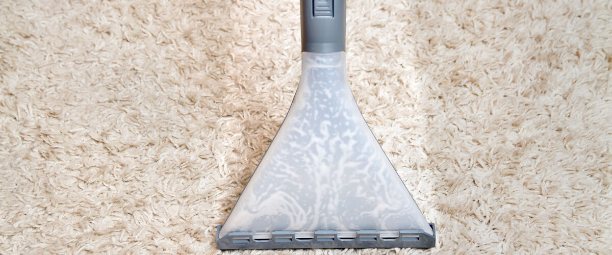 Carpet cleaning using a steam cleaner nozzle in San Mateo County.