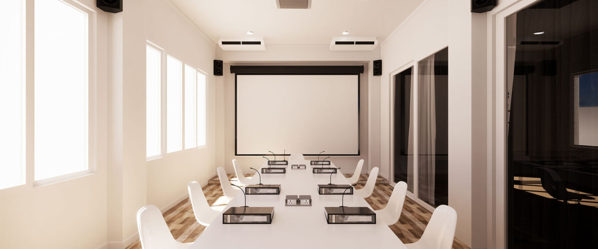 Modern conference room in San Mateo County with a projector, screen, and seating for nine, including commercial cleaning.